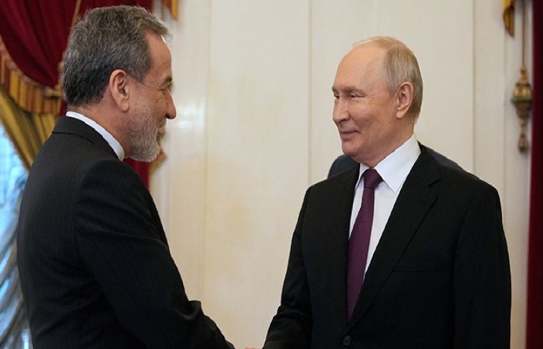 Russian President Vladimir Putin and Iranian Foreign Minister Abbas Araghchi
